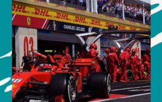 Cover graphic for a press release - image is a car and pit crew following a pit stop during a Grand Prix